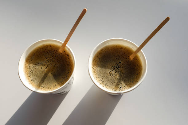2 paper cup boxes are on the table in the cafe. coffee to go. morning. - junk food stock pictures, royalty-free photos & images
