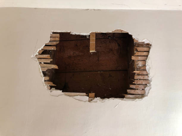 a big hole on the wall in an abandoned building at vevey, switzerland - home decoration stock pictures, royalty-free photos & images