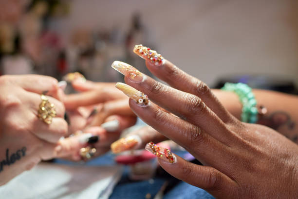 a close-up of a models hand in a nail spa - nails art stock pictures, royalty-free photos & images