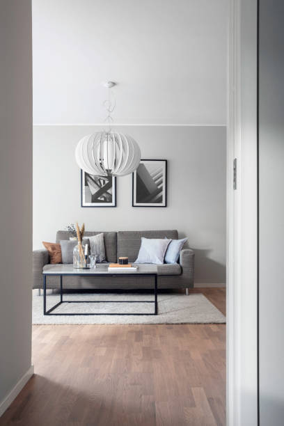 a glimpse into a modern living room from a doorway - home decoration stock pictures, royalty-free photos & images