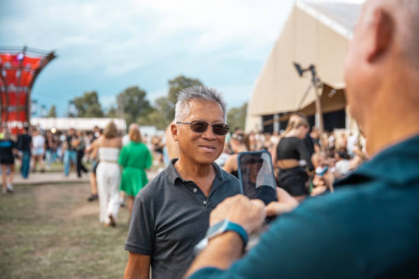 a handsome senior man at a daytime dance event - concert stock pictures, royalty-free photos & images