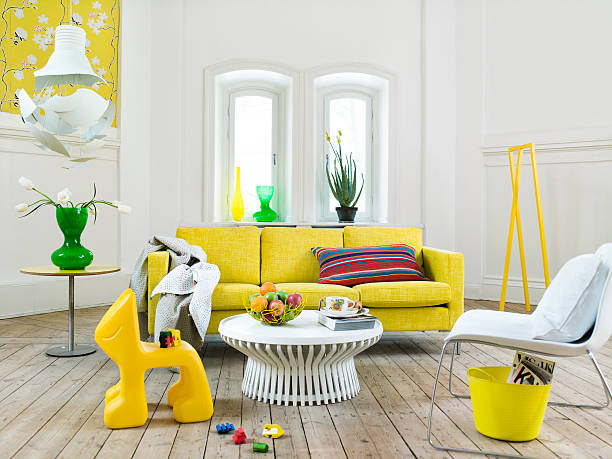 a light living room with yellow details, sweden. - home decoration stock pictures, royalty-free photos & images