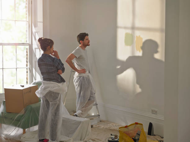 a man and woman doing diy in new home - home decoration stock pictures, royalty-free photos & images