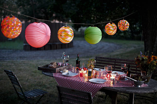 a messy table after a dinner party - garden decoration stock pictures, royalty-free photos & images