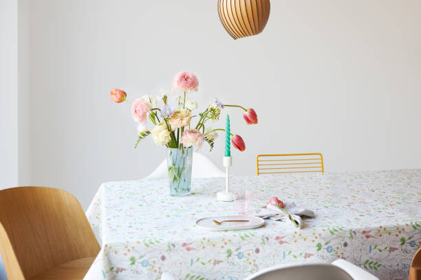 a modern spring bouquet of freesias, ranunculus and tulips in a beautiful vase - home decoration stock pictures, royalty-free photos & images
