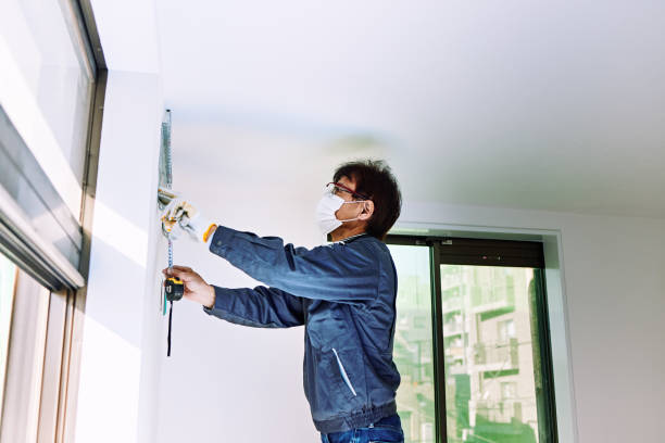 a senior man working in a home remodeling house. - home decoration stock pictures, royalty-free photos & images