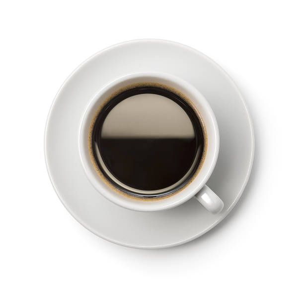 a top-down picture of a cup of coffee on a plate - coffee stock pictures, royalty-free photos & images