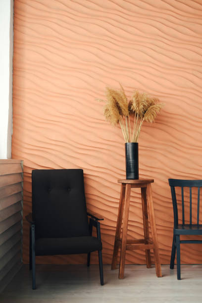 a vase with reeds in a stylish interior. - home decoration stockfoto's en -beelden