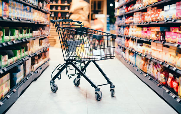 abandoned shopping cart with groceries - food stock pictures, royalty-free photos & images