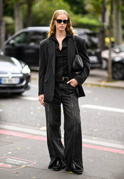 Abby Champion is seen wearing a black blazer, black shirt, black jeans, black bag and black sunglasses outside the Zimmermann show during Womenswear...