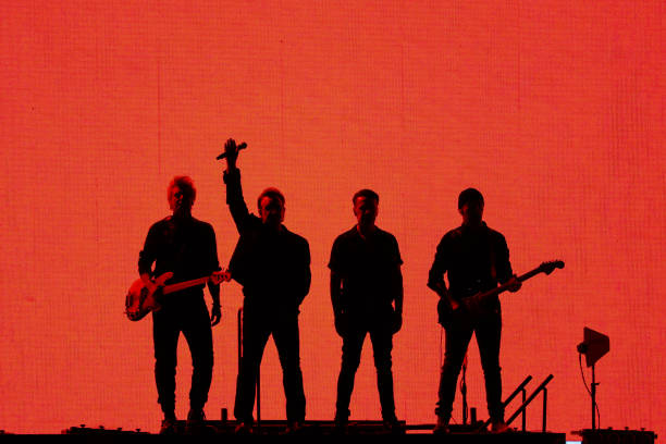 Adam Clayton, Bono, Larry Mullen Jr. And The Edge of U2 perform at Saitama Super Arena on December 04, 2019 in Saitama, Japan.