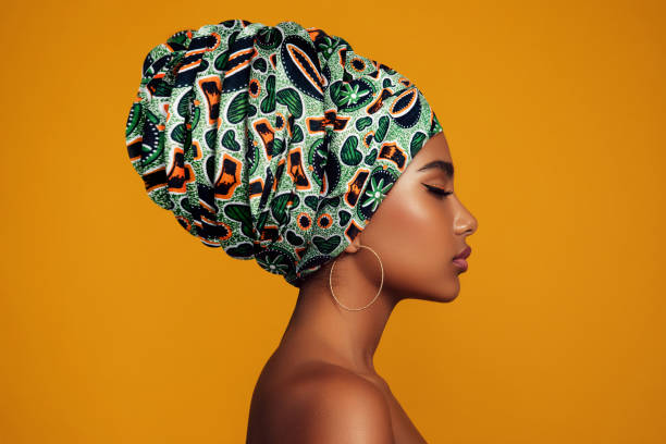 african woman with a colorful shawl on her head - fashion stock pictures, royalty-free photos & images