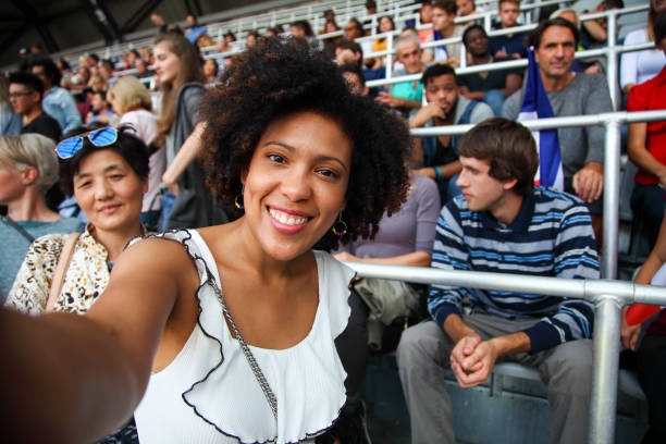 afro-american woman selfie at a sport event - concert stock pictures, royalty-free photos & images