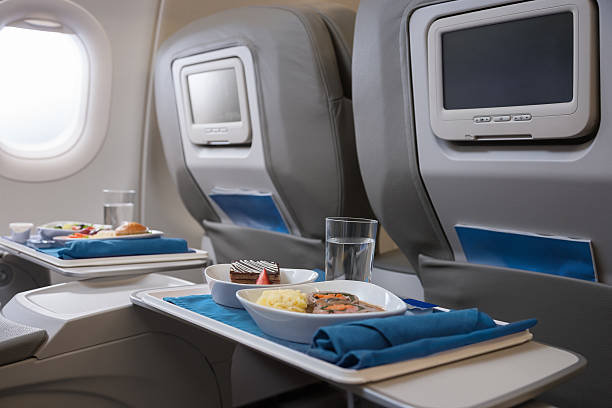 airline meals served on seat tables - food stock pictures, royalty-free photos & images