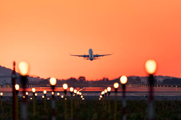airplane taking off at sunrise, travel and tourism - travel stock-fotos und bilder