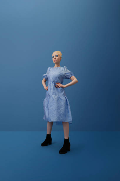 albino woman standing with hand on hip - fashion stock pictures, royalty-free photos & images