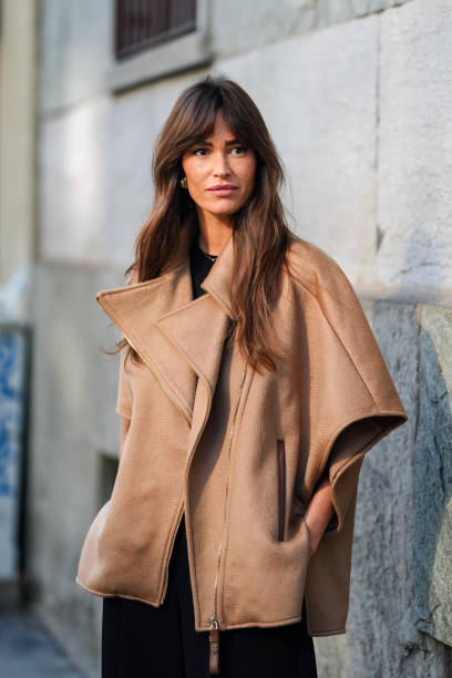 Alison Toby wears light brown short sleeve oversized unzipped jacket, outside Max Mara, during the Milan Fashion Week Spring/Summer 2024-2025 on...