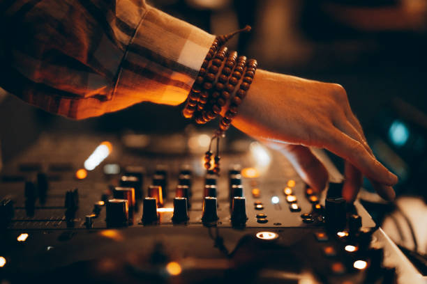 american dj working with sound, spinning turntable records at a night club party - concert stock pictures, royalty-free photos & images
