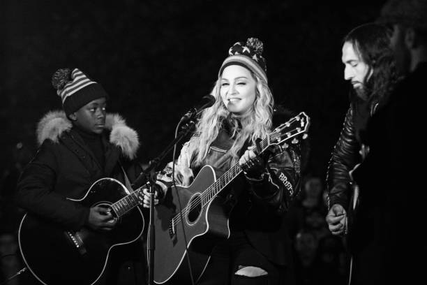 American Pop musician Madonna plays guitar during a surprise concert in support of Hillary Clinton's presidential candidacy, on the eve of Election...