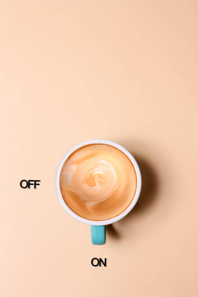 an empty glass cup of coffee on the beige background - junk food stock pictures, royalty-free photos & images