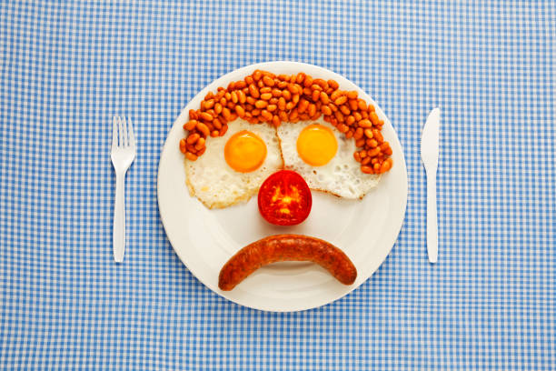 an unhappy fast-food breakfast - food stock pictures, royalty-free photos & images