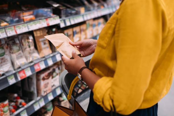 an unrecognizable woman shopping at the supermarket - food stock pictures, royalty-free photos & images