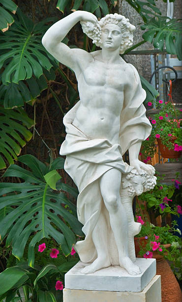 ancien statue in the garden - garden decoration stock pictures, royalty-free photos & images