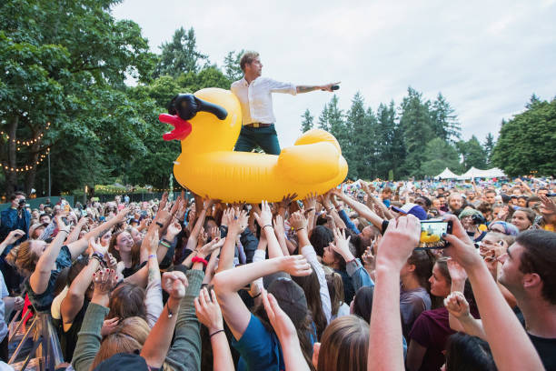 Andrew McMahon of Andrew McMahon In The Wilderness rides an inflatable duck over the crowd while performing during the Summer Camp Music Festival...