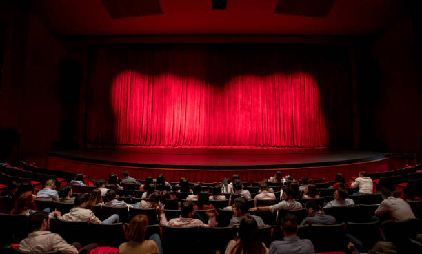 anxious audience waiting for the curtains to open to see the performance - concert stock pictures, royalty-free photos & images