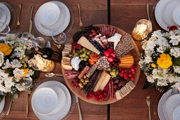 appetizer plate amidst crockery on dining table - garden decoration stock pictures, royalty-free photos & images