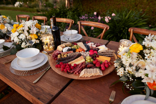 appetizer plate amidst crockery on table for dinner - garden decoration stockfoto's en -beelden