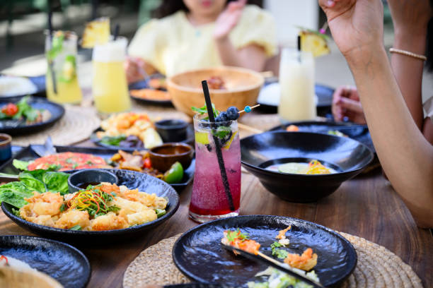 appetizers and fruit drinks covering outdoor resort table - food stock pictures, royalty-free photos & images