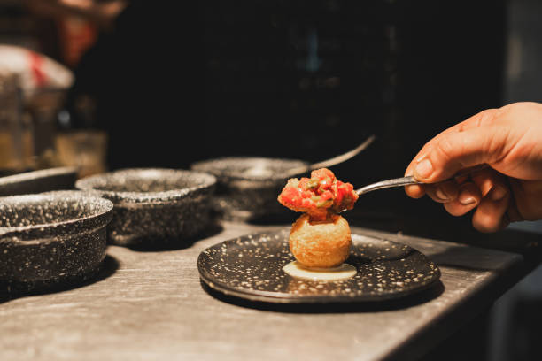 art of plating: a gourmet dish in the making - food stock pictures, royalty-free photos & images