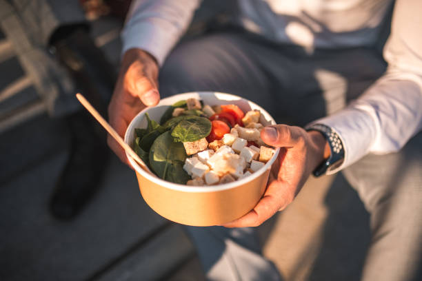 asian businessman and takeaway bowls - junk food stock pictures, royalty-free photos & images