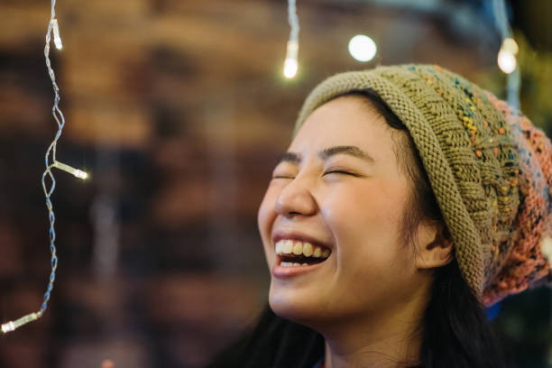 asian chinese female smiling during celebrate christmas party at roof top of house - garden decoration stock pictures, royalty-free photos & images