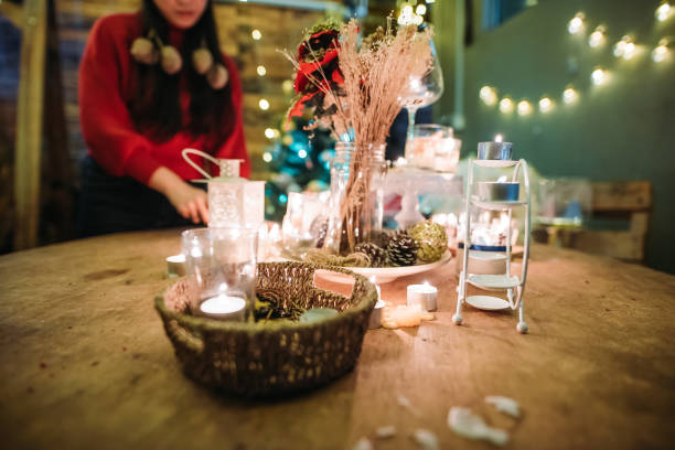 asian chinese female standing behind the decoration table during celebrate christmas party at roof top of house - garden decoration stock pictures, royalty-free photos & images