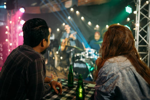 asian couple celebrating at party. - concert stock pictures, royalty-free photos & images