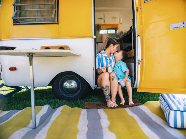 asian mother and son enjoying trailer camping outdoors - fashion stock pictures, royalty-free photos & images