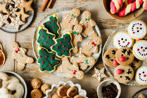 assorted christmas cookies on festive table - food stock pictures, royalty-free photos & images