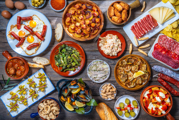 assorted tapas from spain food, typical spanish recipes, and pintxos on a rustic wood - food stock pictures, royalty-free photos & images