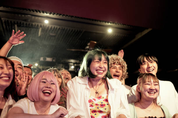 audience members enter the concert hall and run toward the stage with cheers. - concert stock pictures, royalty-free photos & images