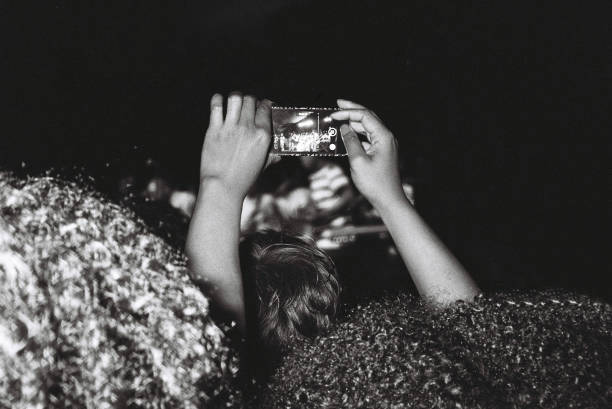 audience taking photo - concert stock pictures, royalty-free photos & images