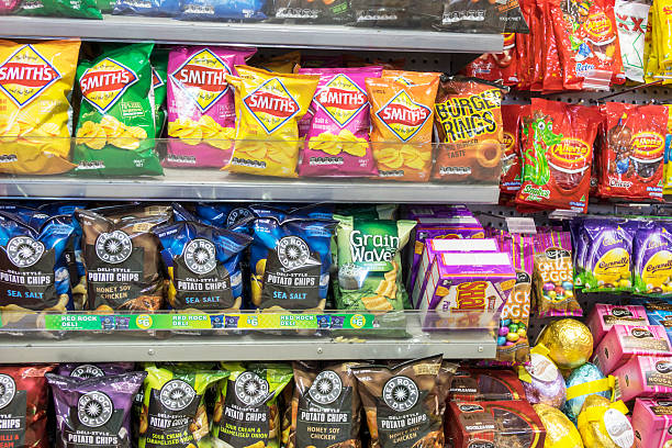 Australia, Victoria Melbourne Central Business District CBD Flinders Street pharmacy drugstore sale shelves convenience store junk food potato chips...
