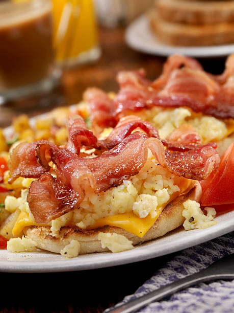 bacon and egg breakfast sandwich - junk food stock pictures, royalty-free photos & images