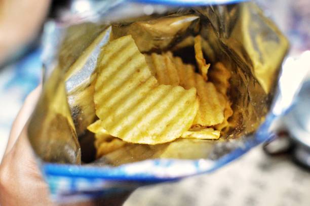 bag of potato chips - junk food stock pictures, royalty-free photos & images