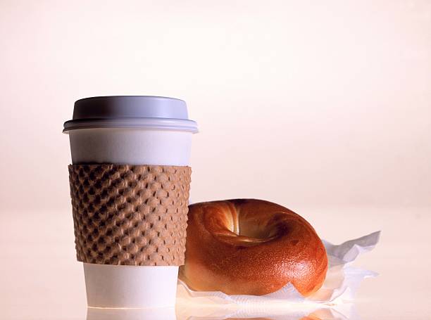 bagel and coffee cup - junk food stock pictures, royalty-free photos & images