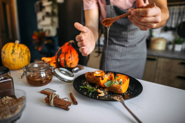 baked pumpkin, decorating holiday sweet on a plate. - food stock pictures, royalty-free photos & images