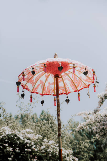 balinese umbrella - garden decoration stock pictures, royalty-free photos & images