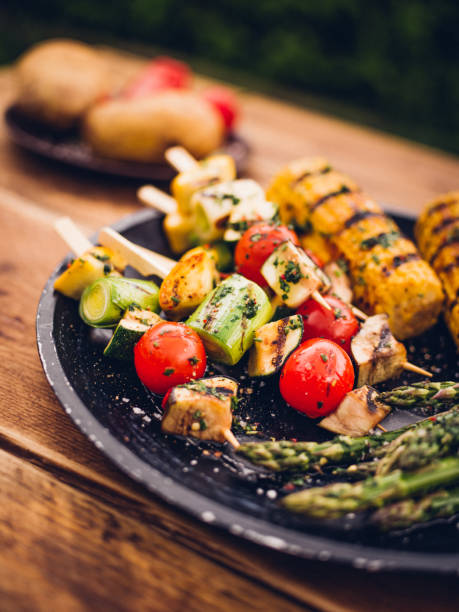 barbecue grilled vegetable kebabs, corn and asparagus on a plate - food stock pictures, royalty-free photos & images