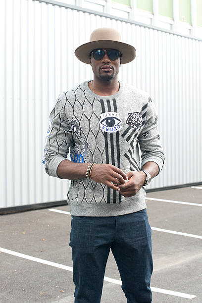 Basketball player Serge Ibaka wears Kenzo jumper and Prada sunglasses on day 4 of Paris Fashion Week Menswear Spring/Summer 2016 on June 25, 2015 in...